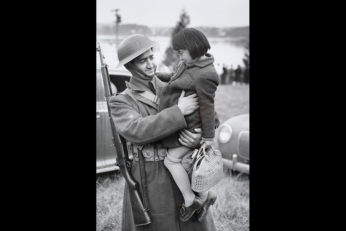 Solider Holds A Young Girl On Day Of Forced Removal BIJAC